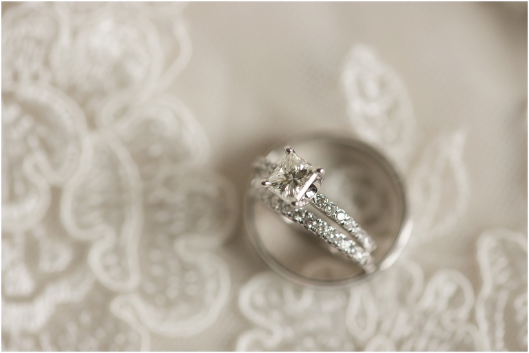 wedding ring set resting on lace