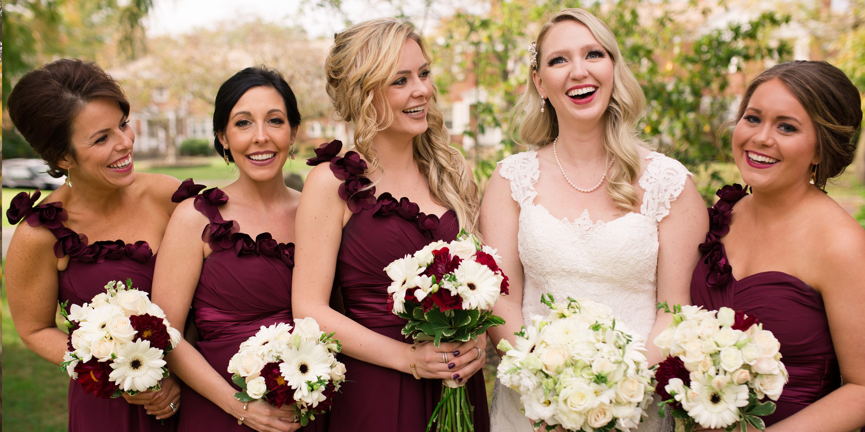 bride and bridesmaids laughing at warren ohio city hall