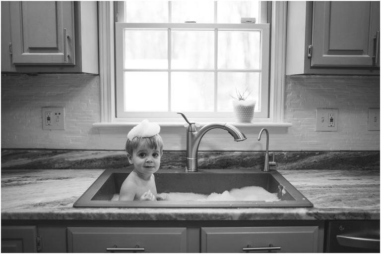 baby in the kitchen sink